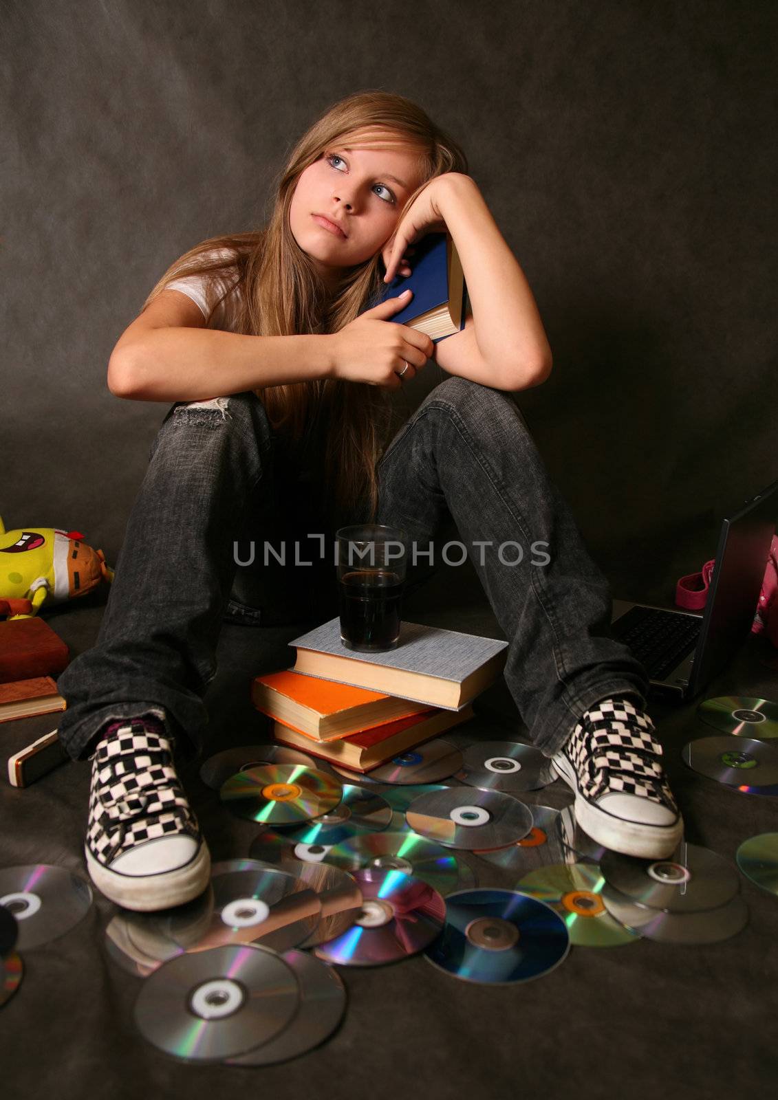 The young girl reads the book