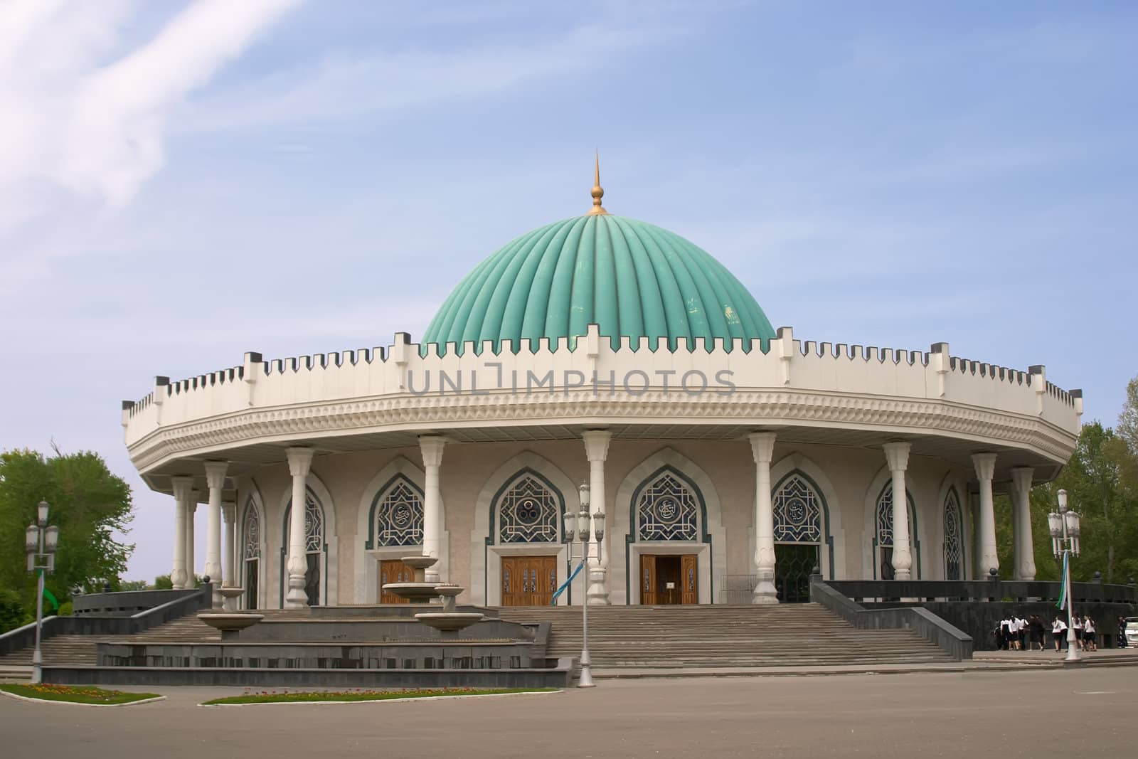 Museum with round roof over blue sky