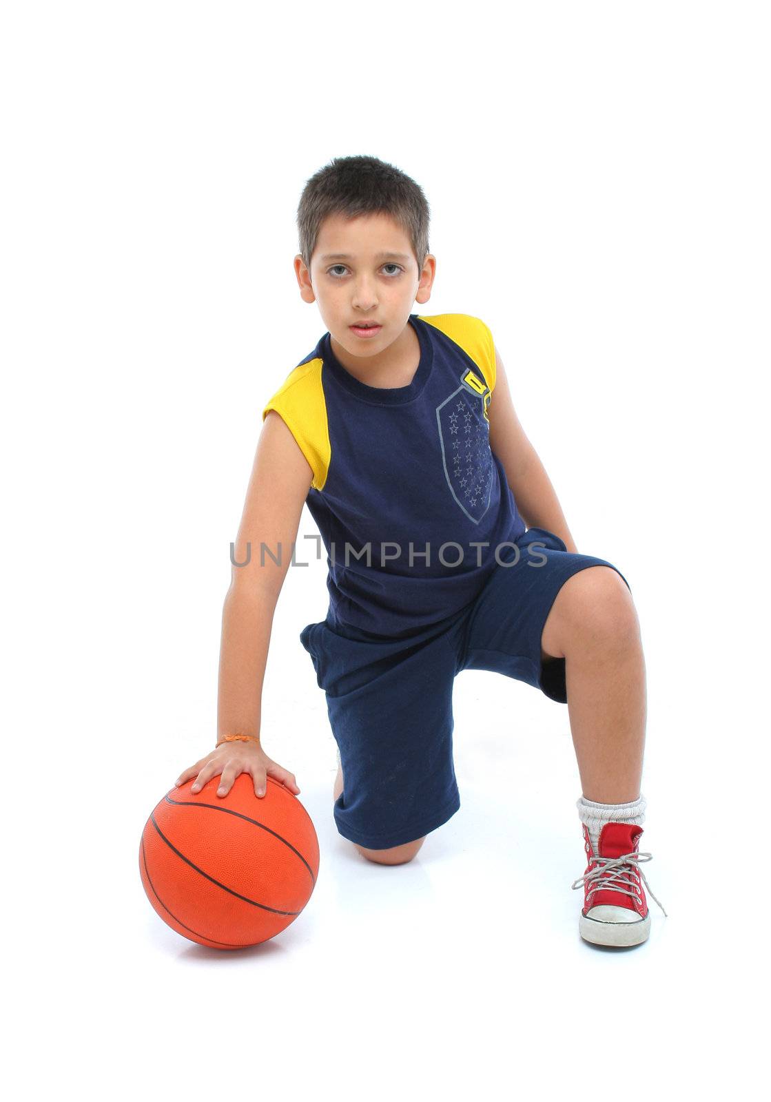 Boy playing basketball isolated by Erdosain