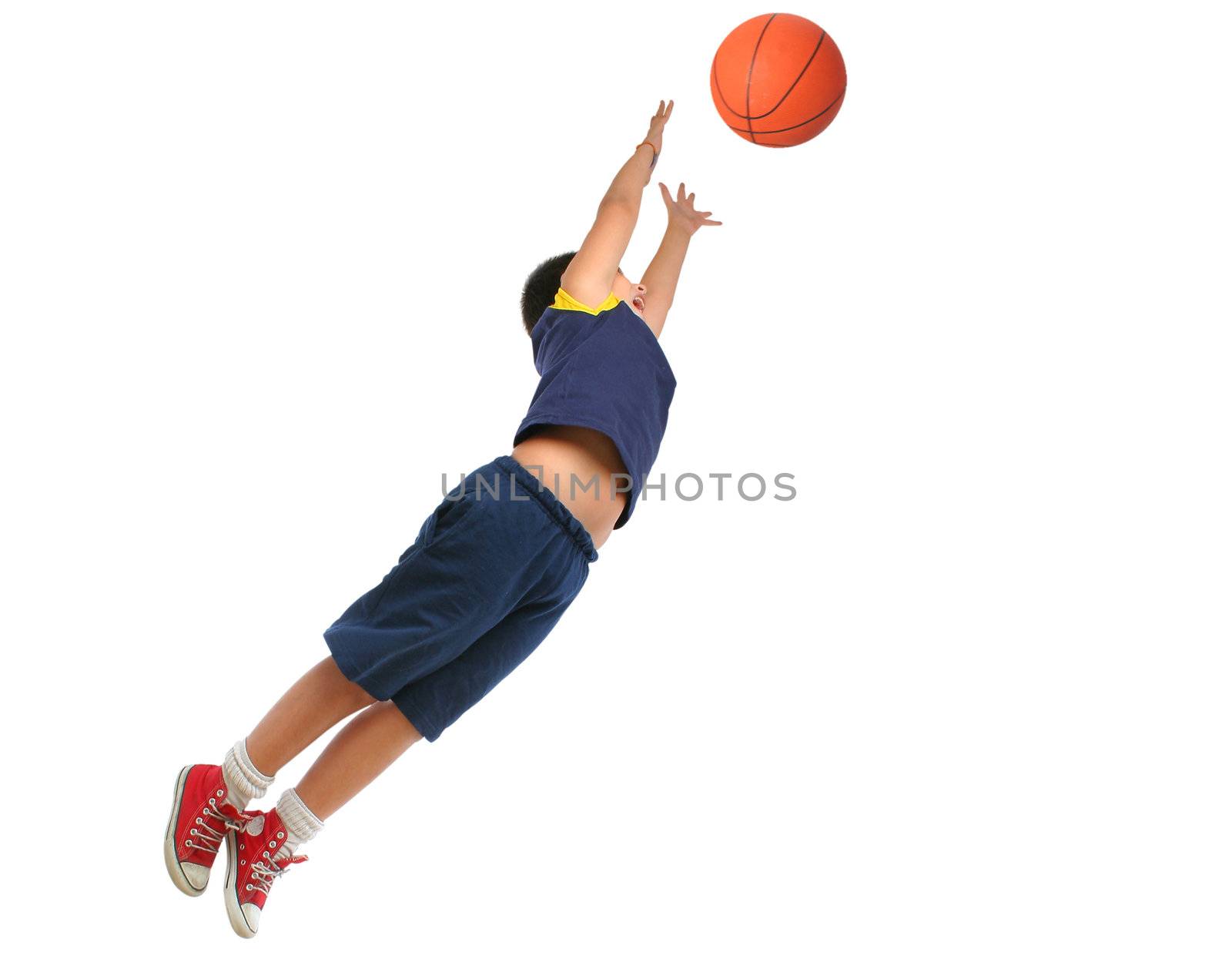 Boy playing basketball isolated. Flying and jumping by Erdosain
