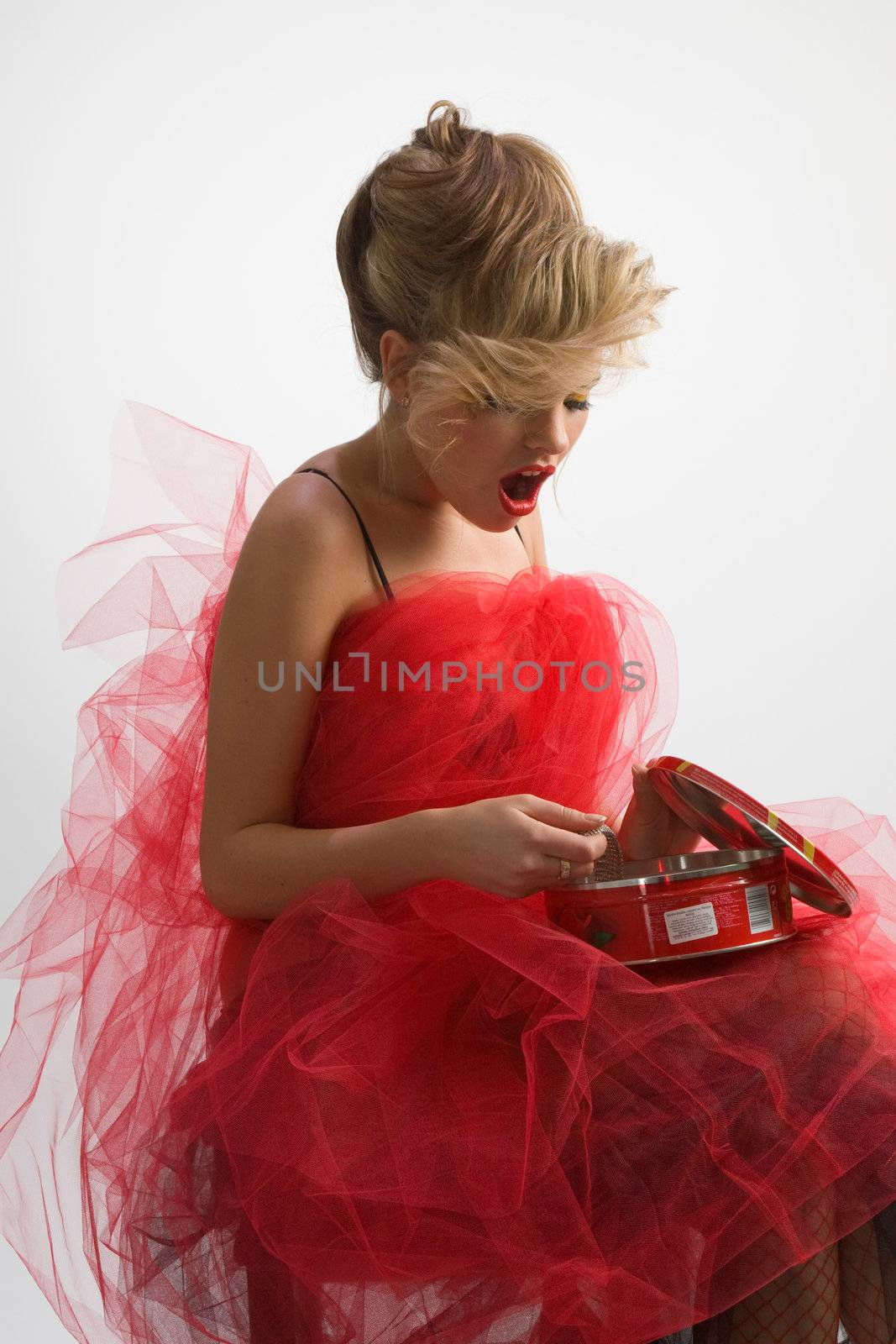 Beautiful woman in red diaphanous skirt to take surprise present