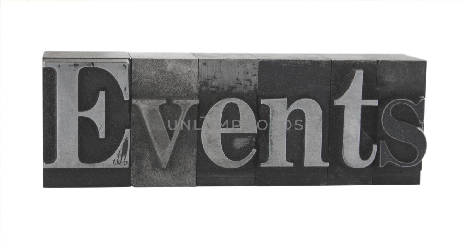 old metal letterpress letters form the word 'Events' isolated on white
