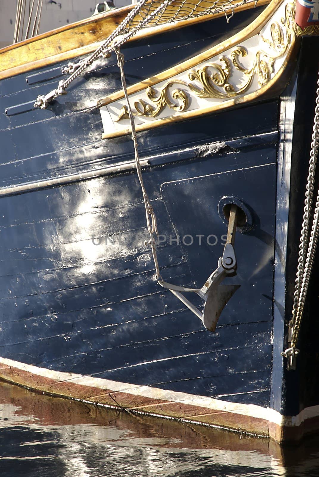 A close up of the waterline of a beautifully crafted sailing ship