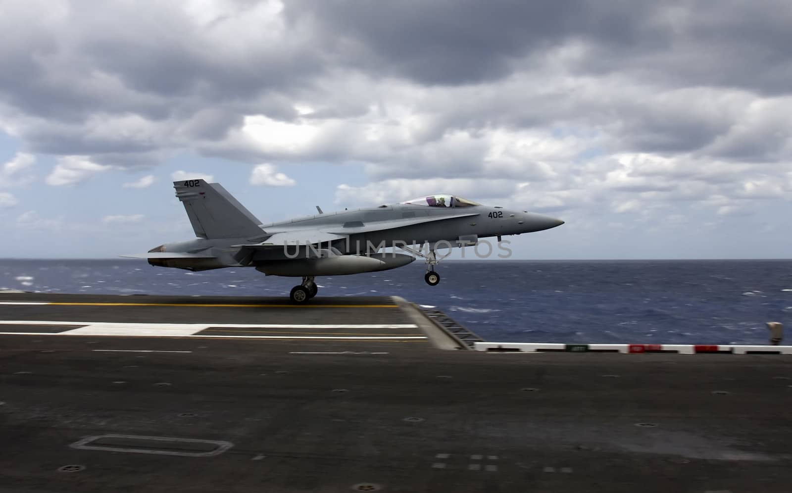 An F-18 Hornet takes flight after a catapult launch from an aircraft carrier