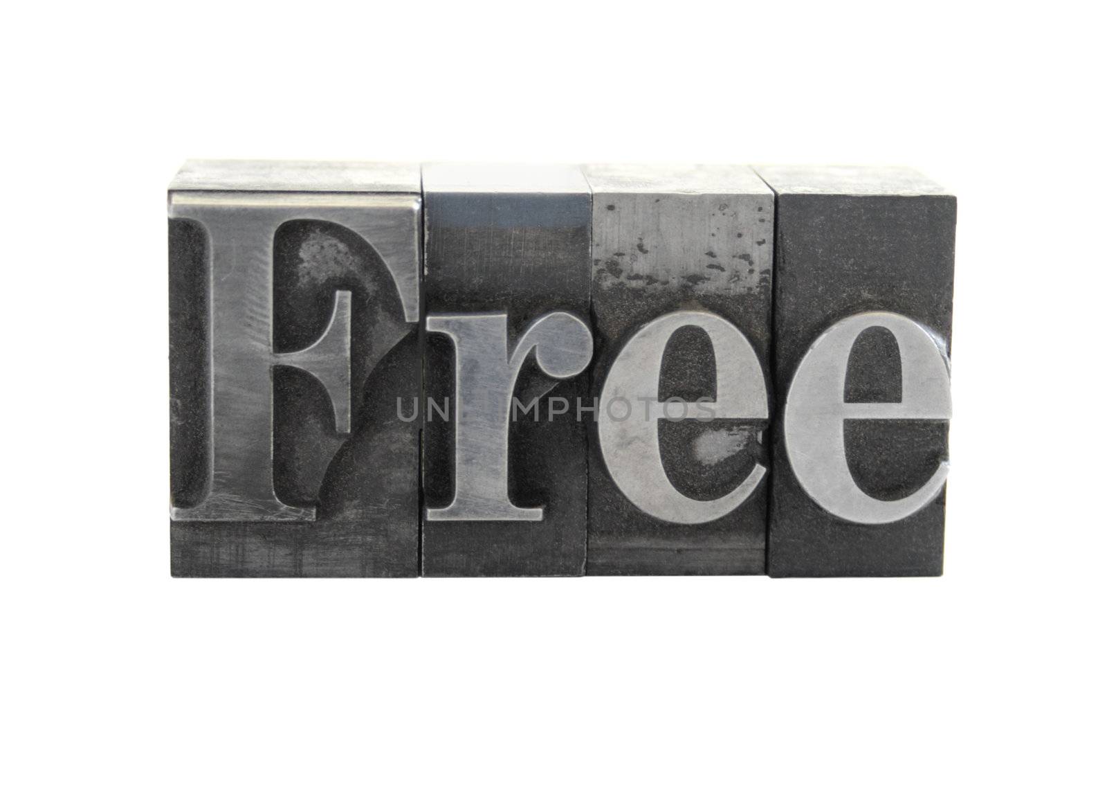 old metal letterpress letters form the word 'free' isolated on white