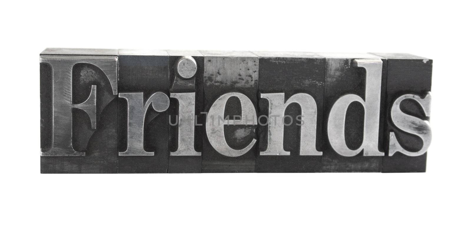 old metal letterpress letters form the word 'Friends' isolated on white