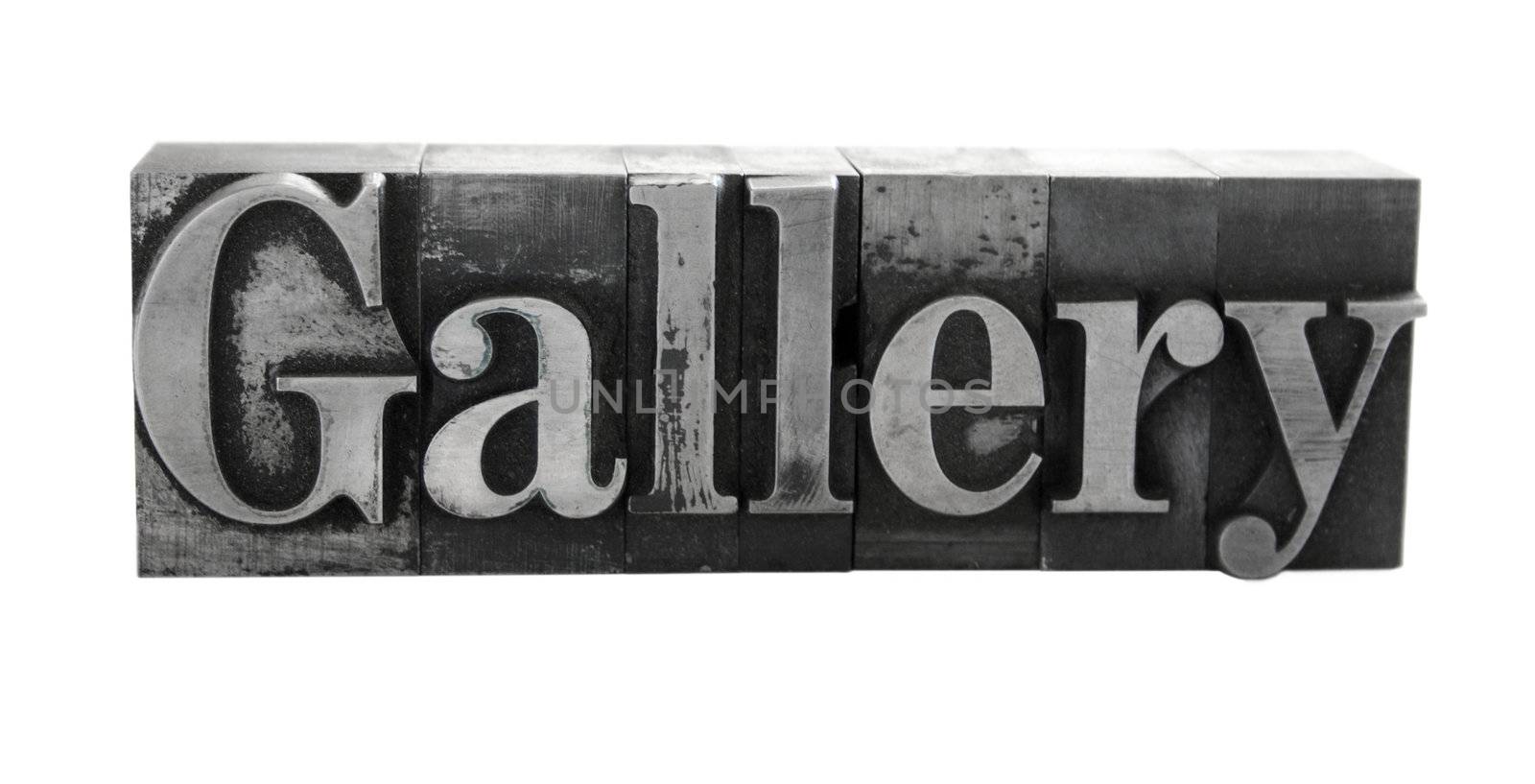 old metal letterpress letters form the word 'Gallery' isolated on white