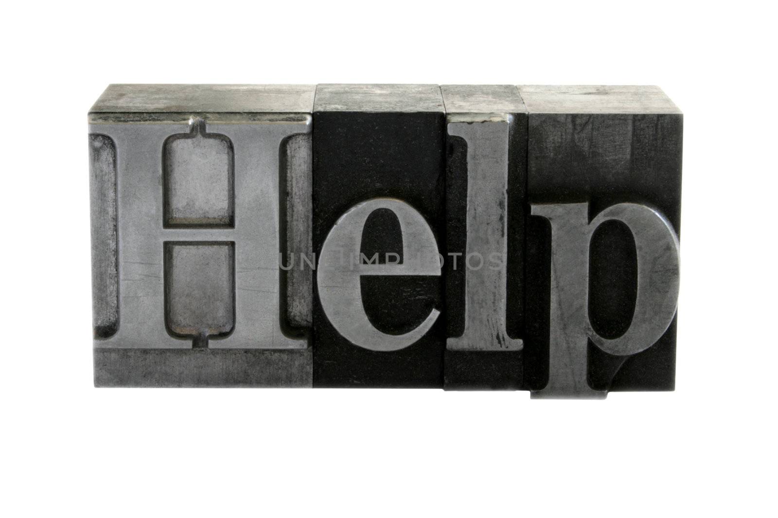old metal letterpress letters form the word 'Help' isolated on white
