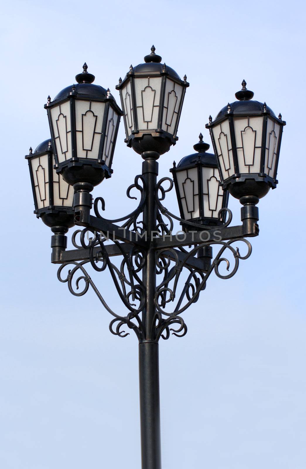 old black street lamp under blue sky