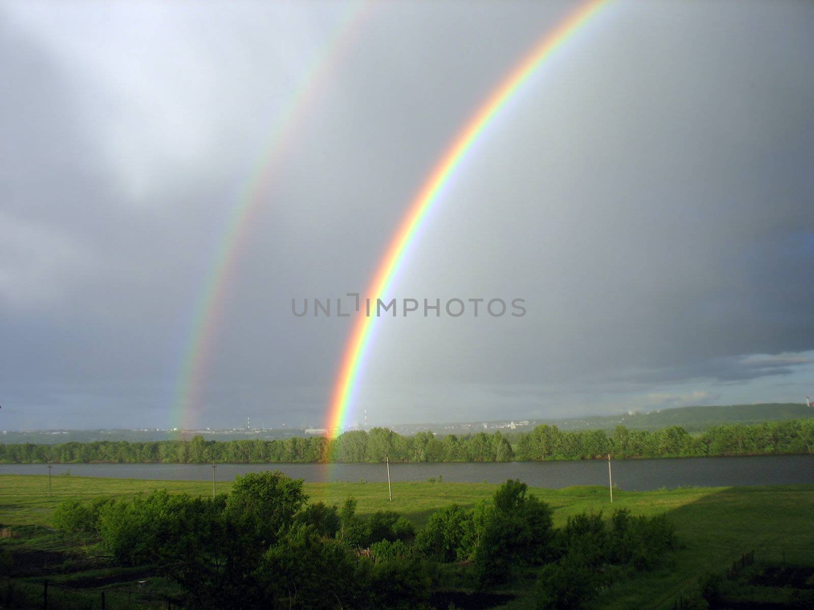 rainbow over lake by Mikko