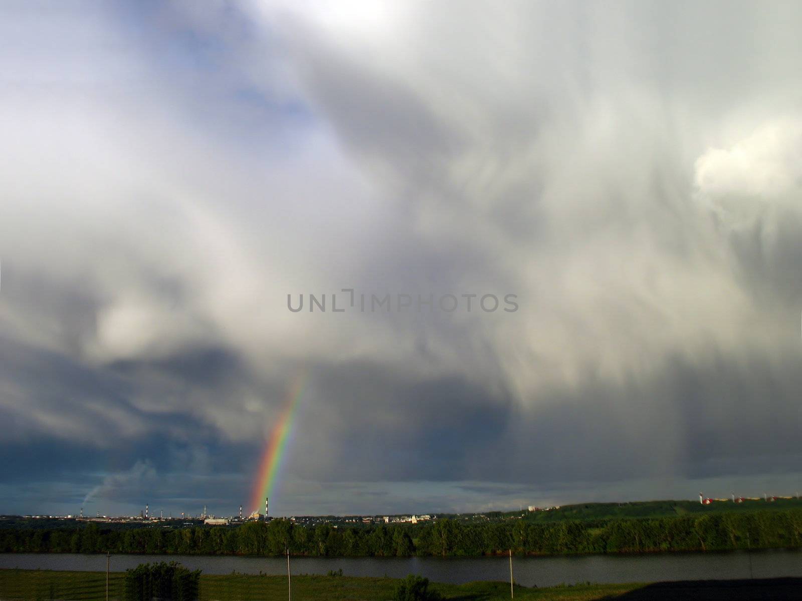 storm clouds landscape with rainbow by Mikko