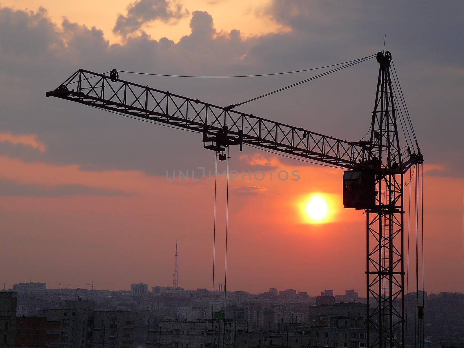 lifting crane and sunset by Mikko