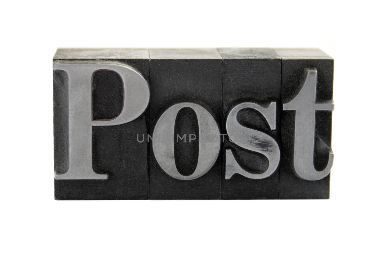 old, ink-stained metal letterpress type spells out the word 'Post' isolated on white