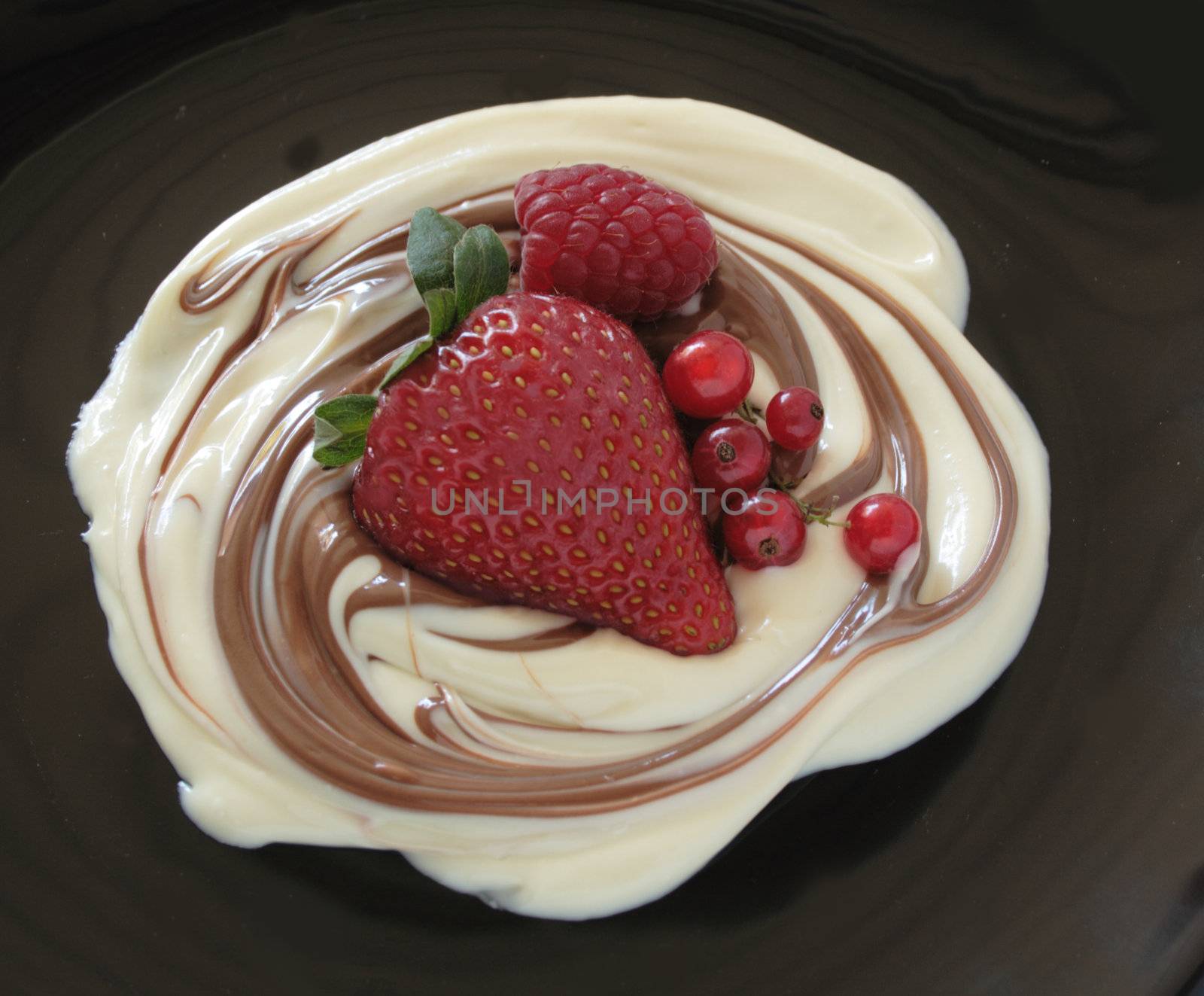 milk chocolate swirled into white chocolate topped with fresh berries and currants