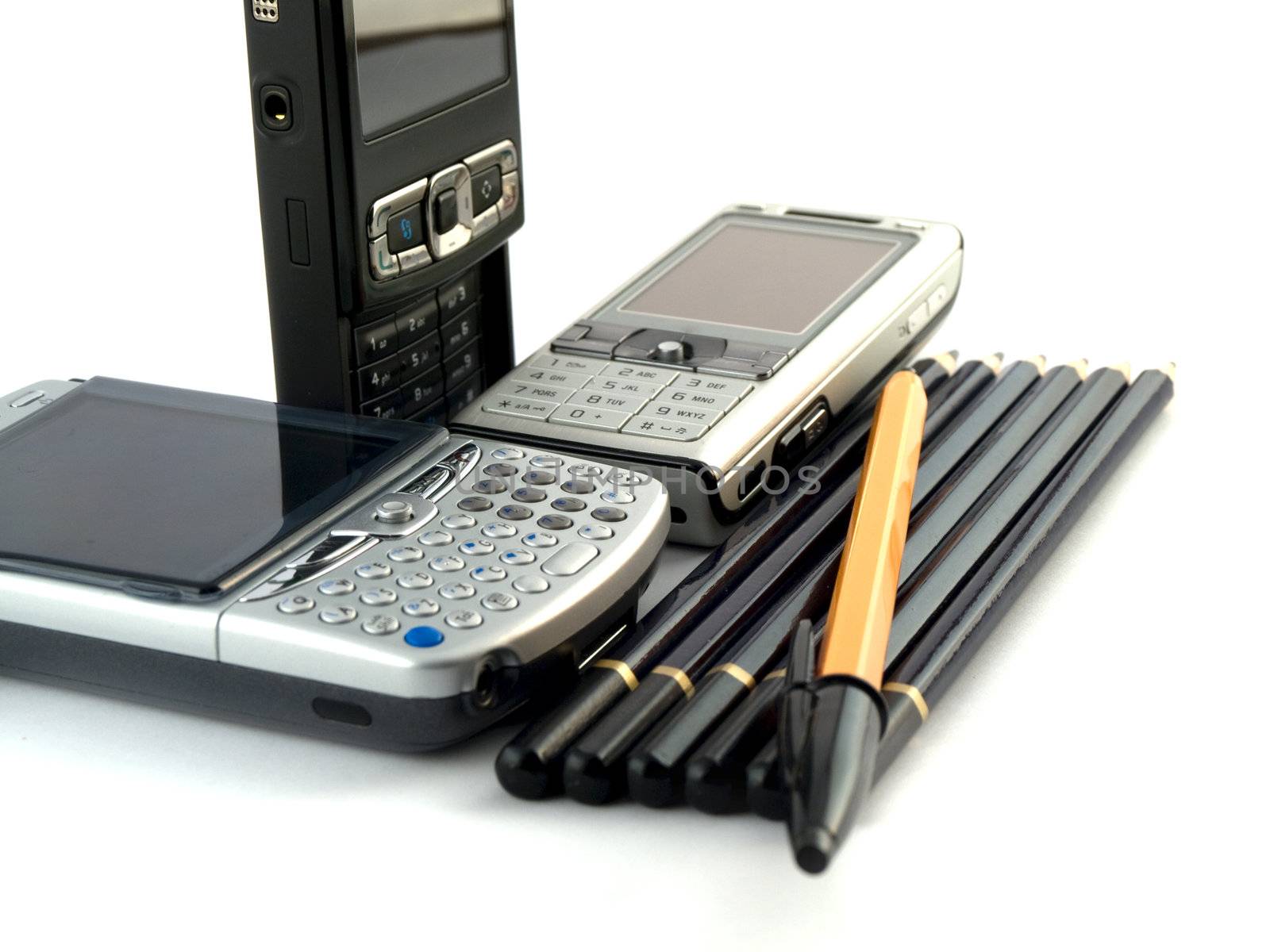 Modern Mobile Phones Pens and Pencils on White Background
