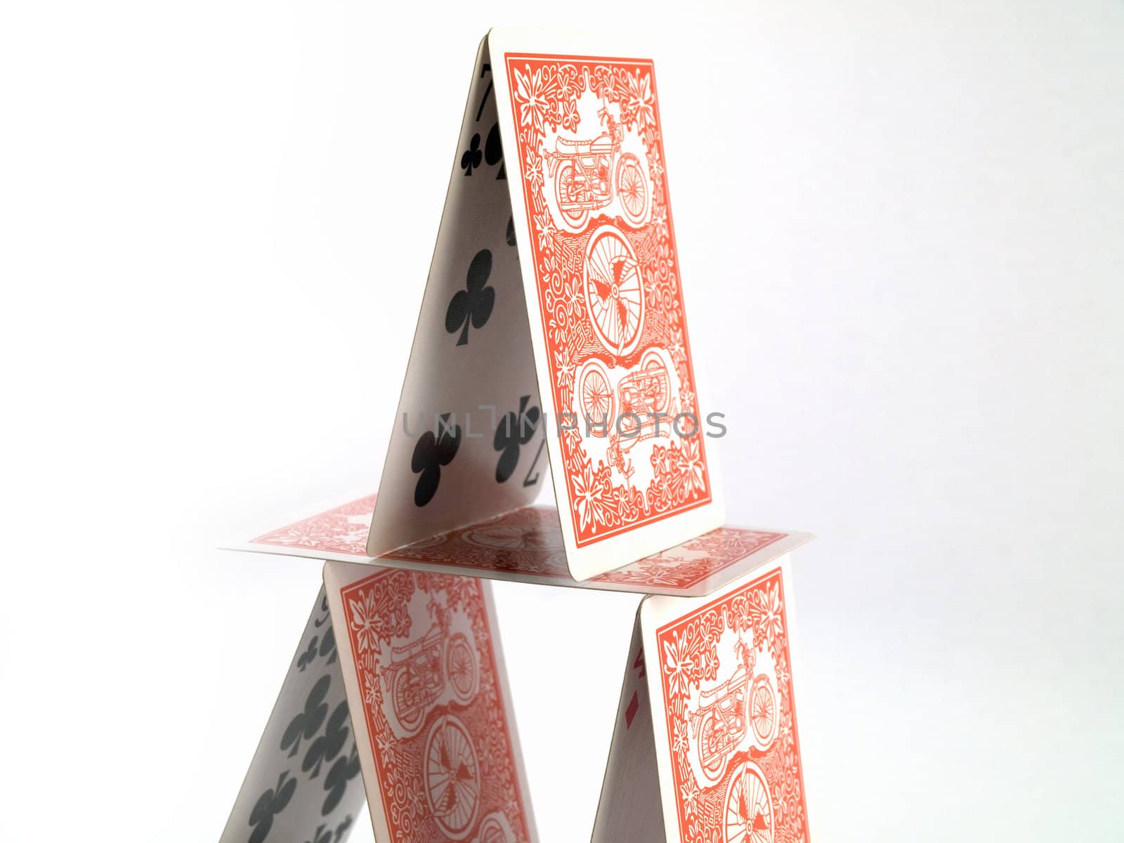 Balanced House of Cards on White Background