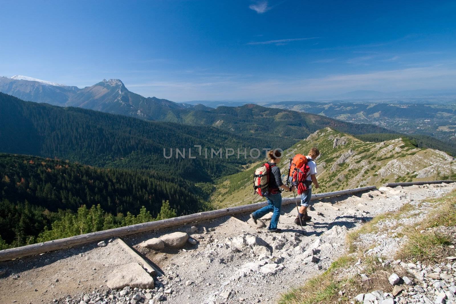 Couple is trekking in mountains. Tatra Mountains, Poland