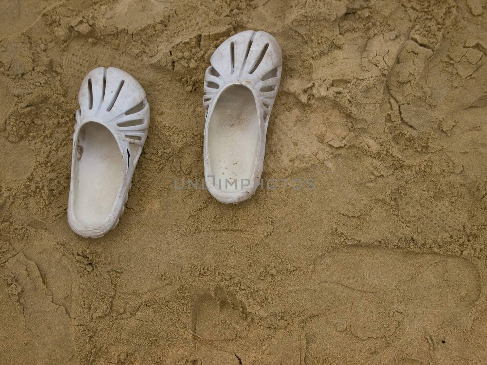 The picture of summer shoes at the sand