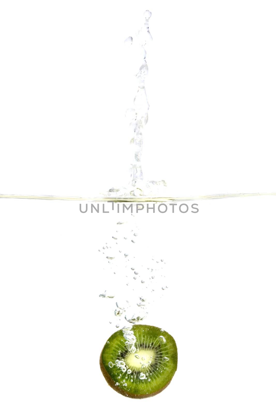 Big kiwi fruit splashing in water