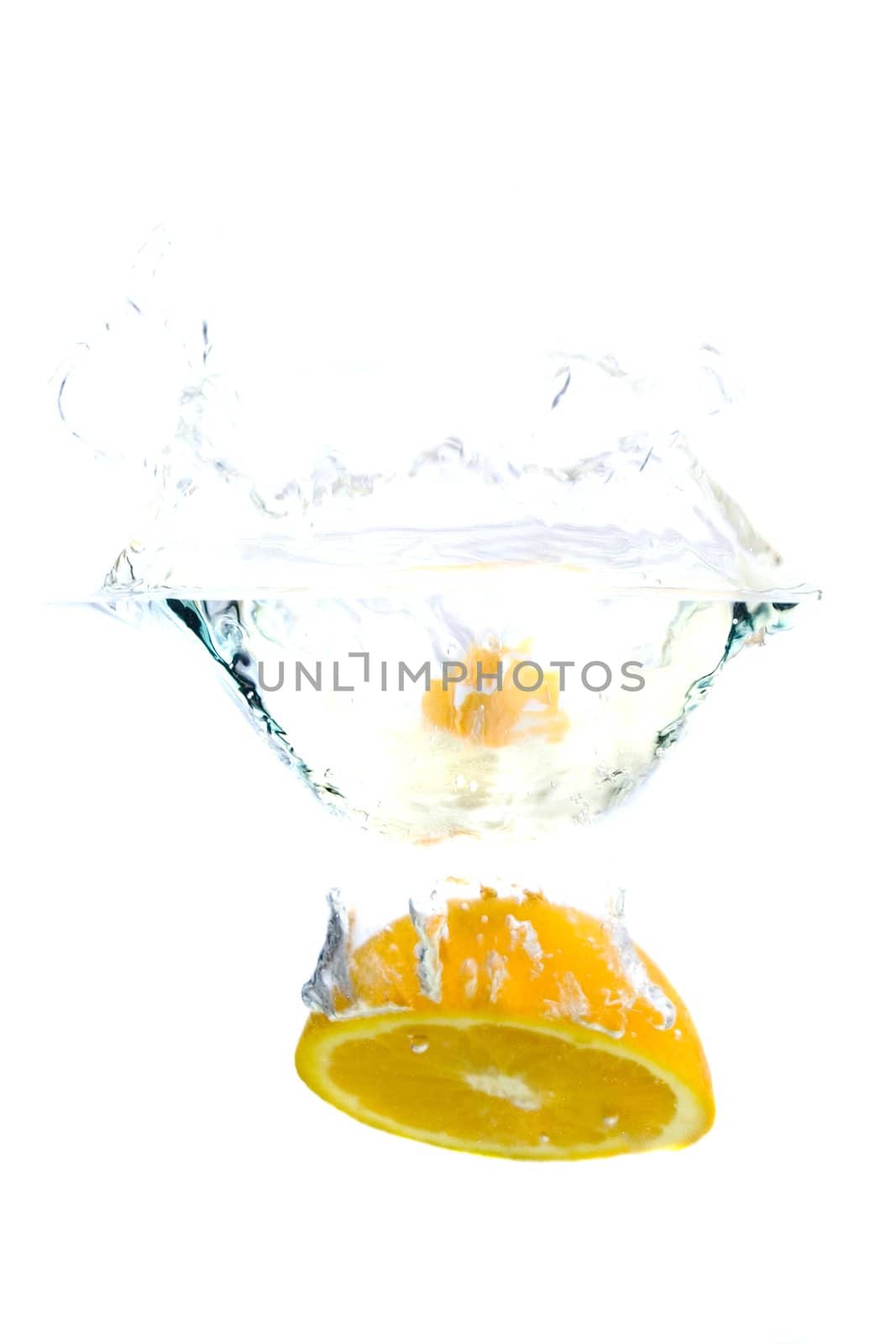 Big orange splashing in water