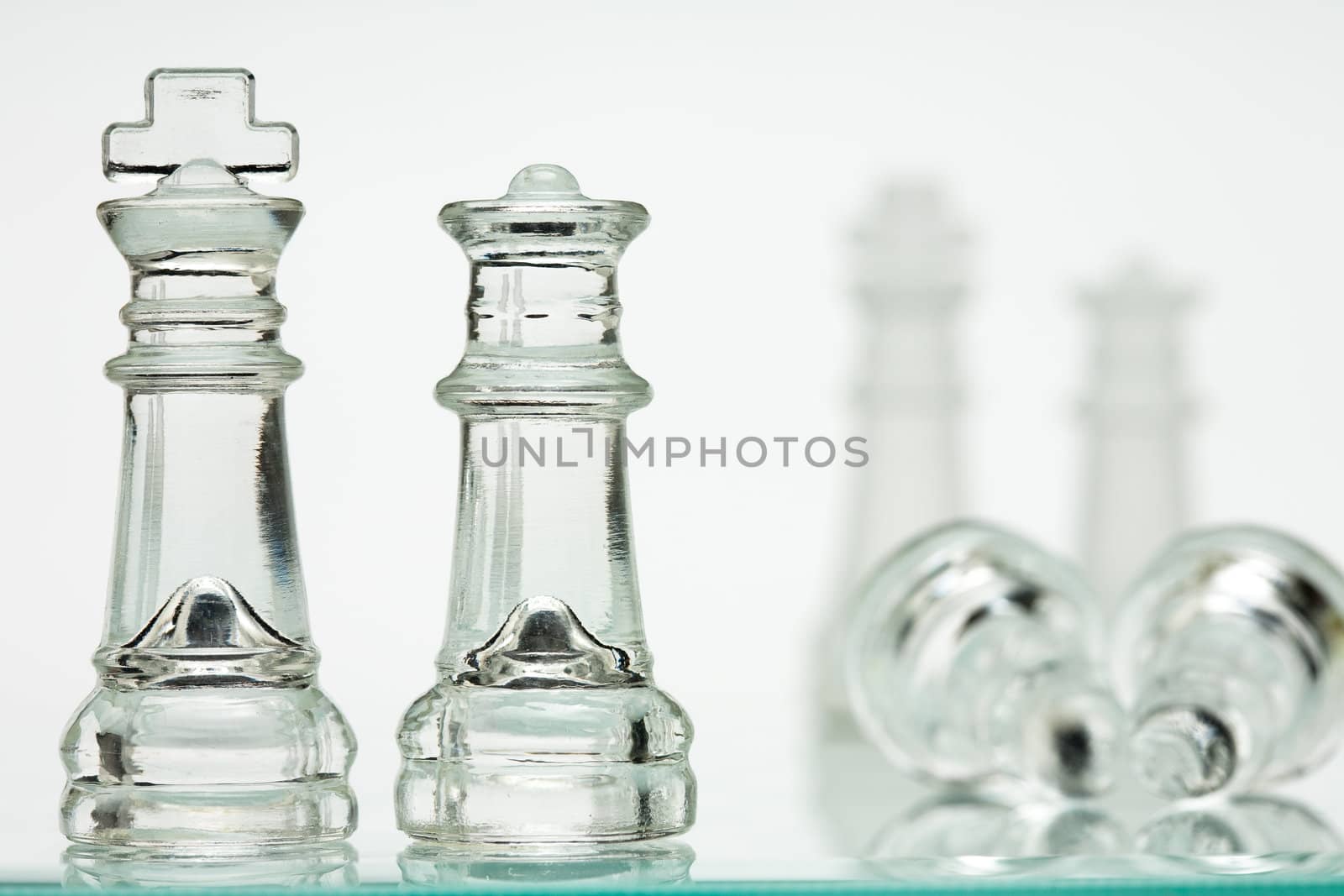 Chess transparent, white background, kings and queens. Two soldiers lie.