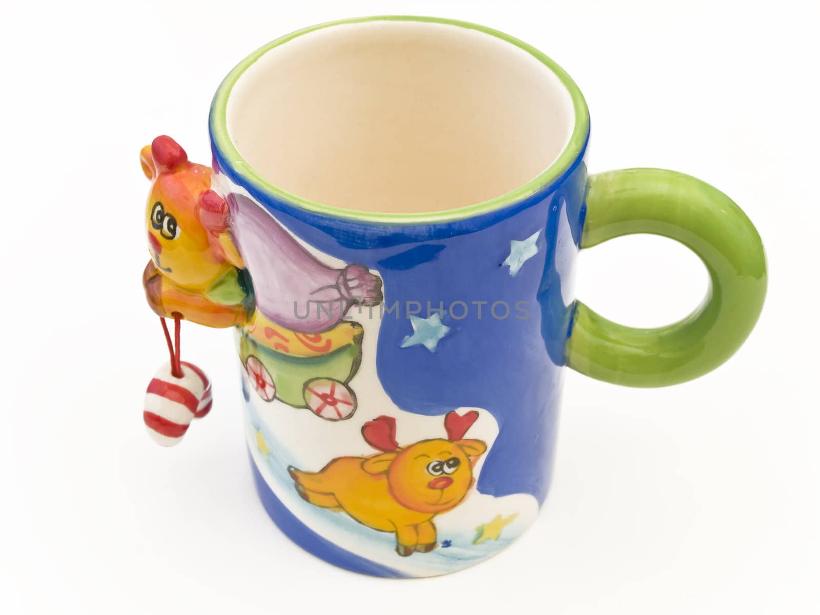 Single multicolored child mug against the white background