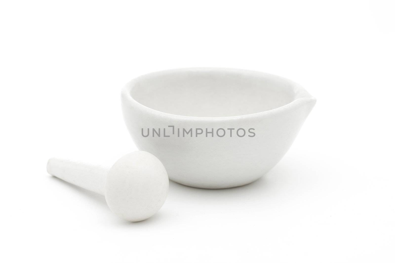 White mortar and pestle over white background