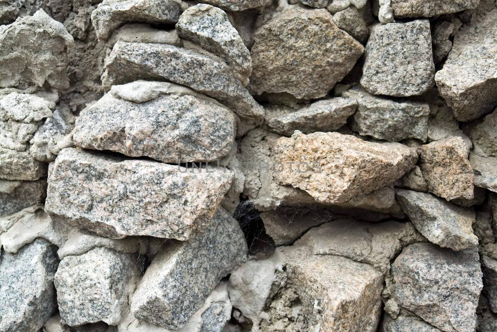 Granite masonry. A stone wall close up.