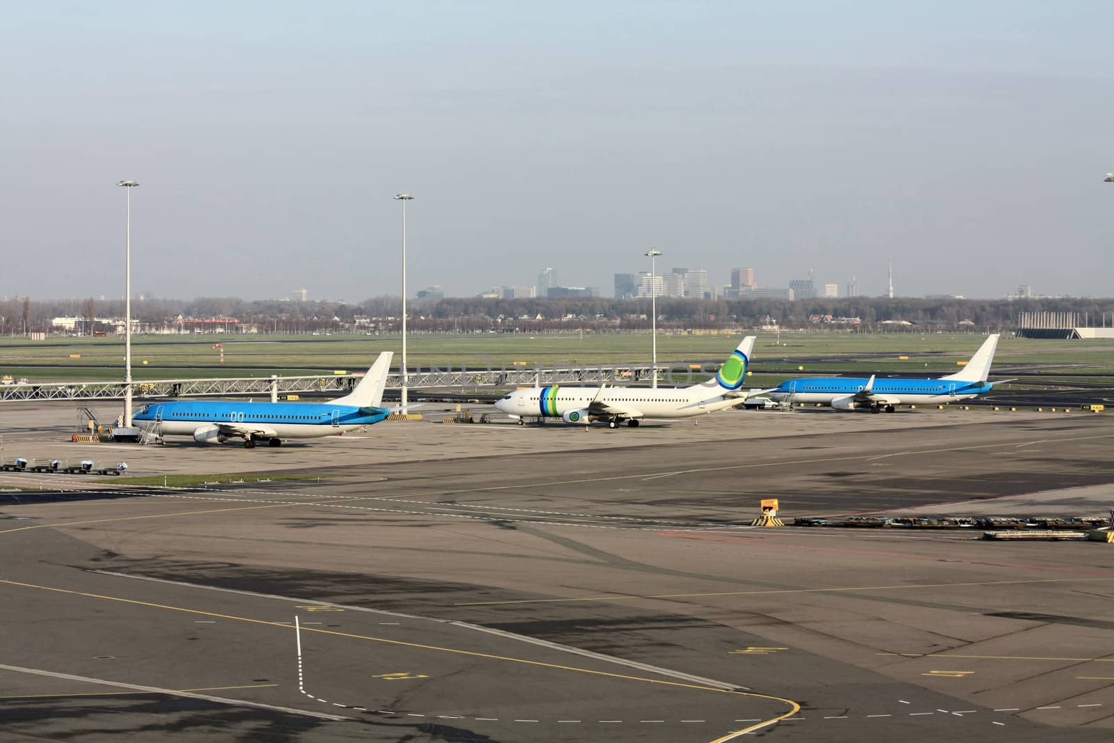 An overview of a major airport, several planes waiting on the gates