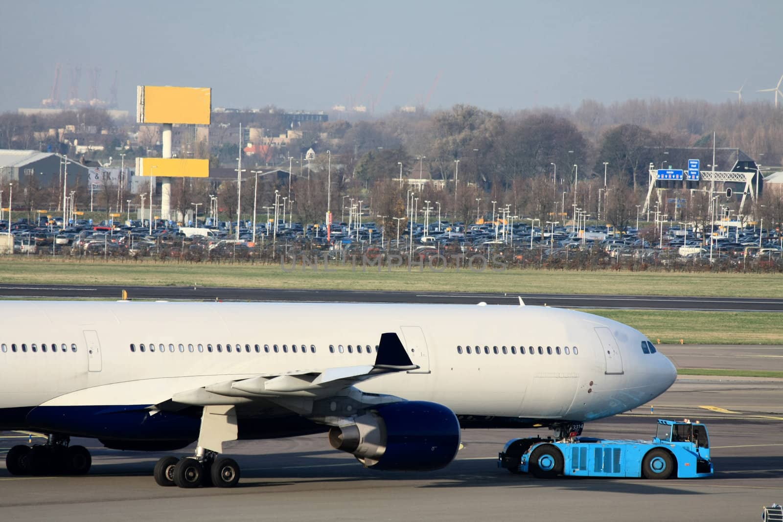 Airplane pulled back from the gate by studioportosabbia