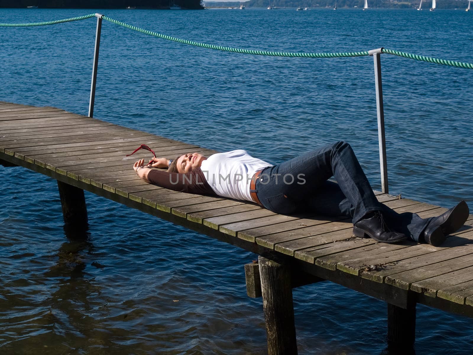 Young attractive woman relaxing and enjoying the sun