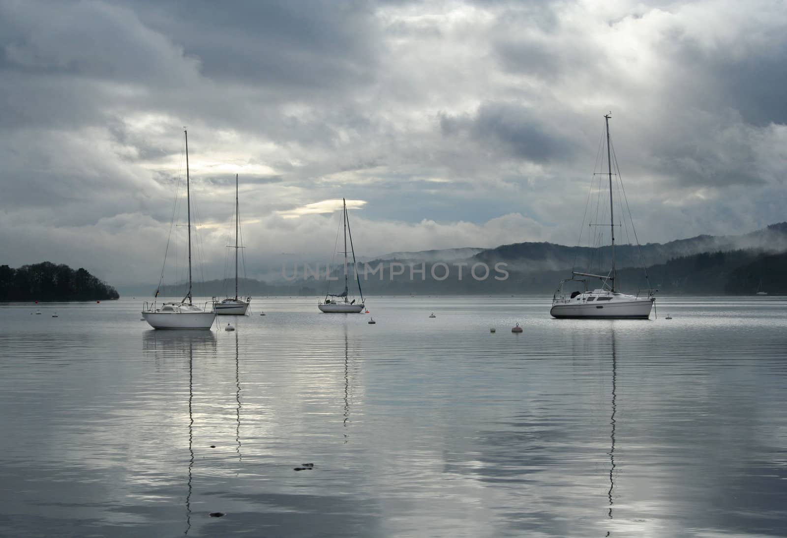 sailing boats on Lake Windermere in English Lake District.
