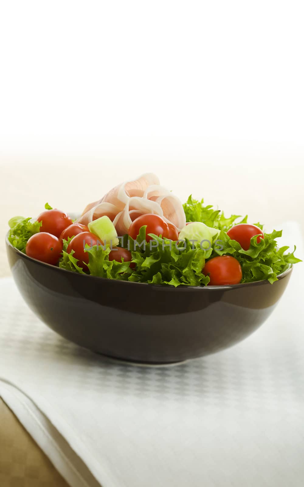 Prosciutto salad with tomatoes on the table