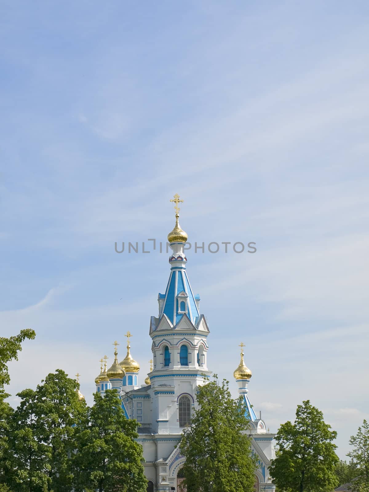 Oriental Church against the blue cloudy sky 