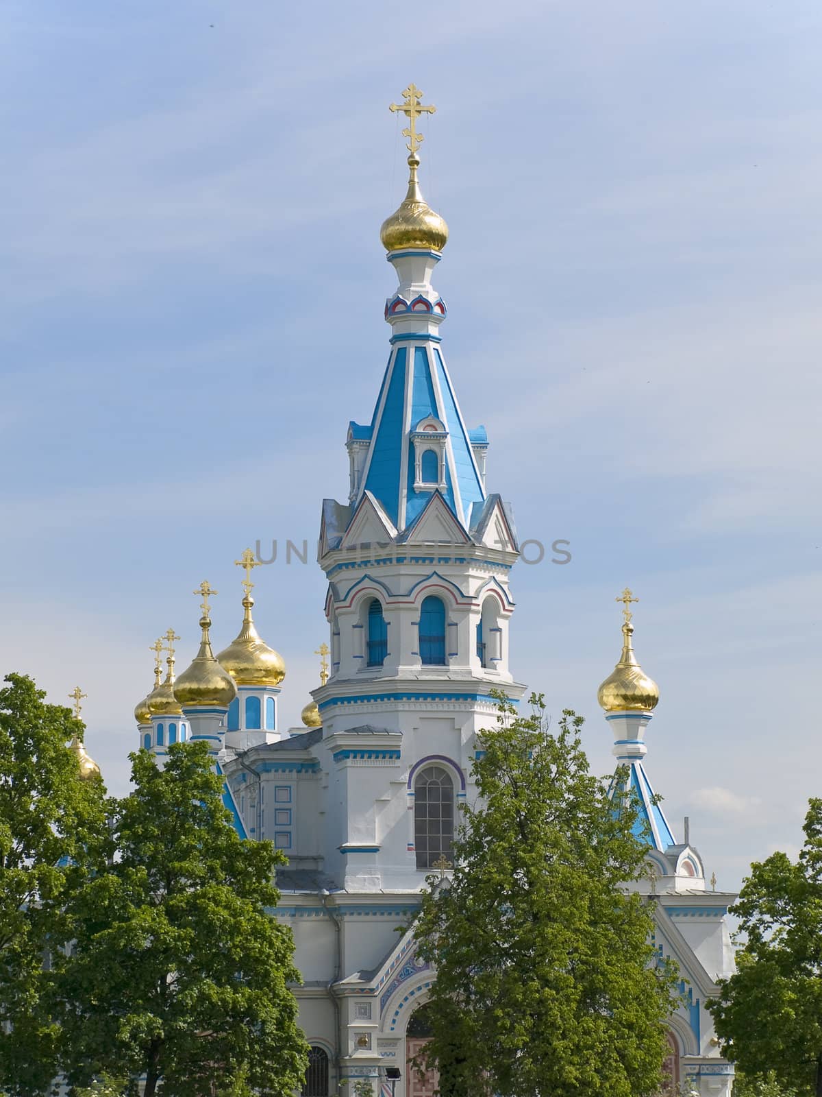 Oriental Church against the blue cloudy sky 