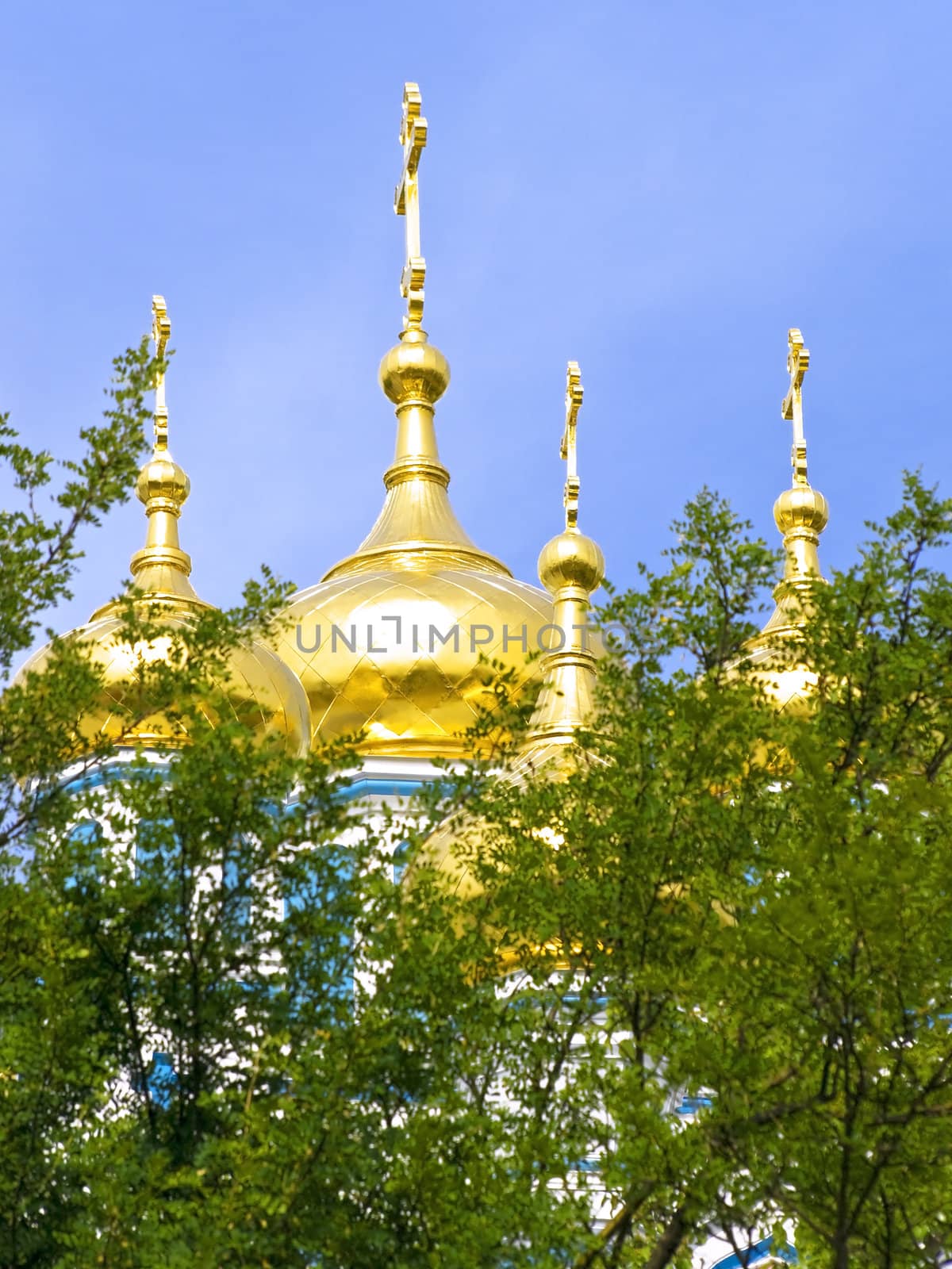 Golden cupola of the church against the blue sky