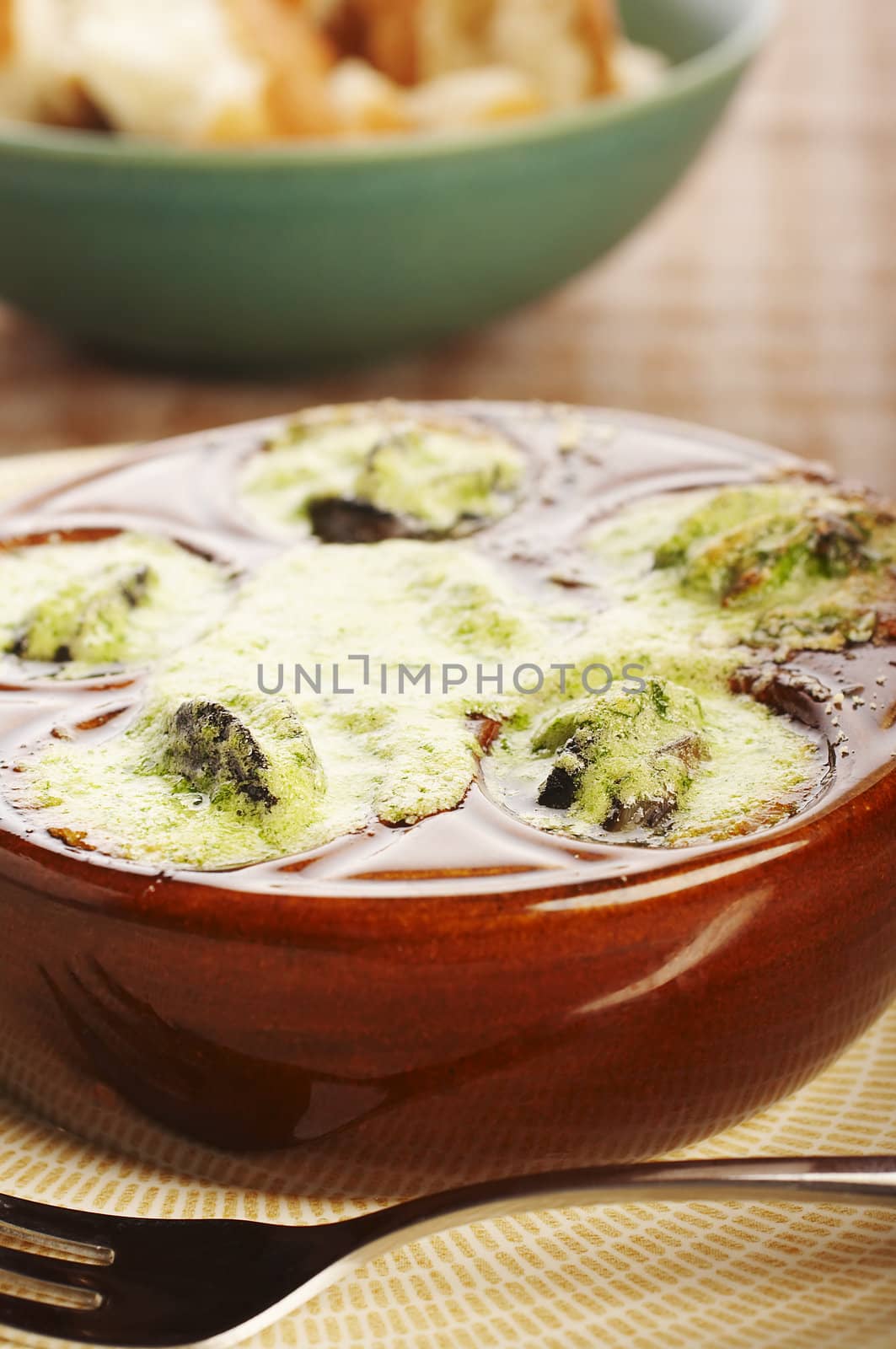 Cooked snail with garlic and butter on the table