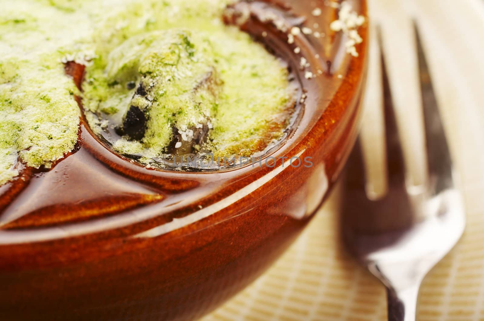 Cooked snail with garlic and butter on the table