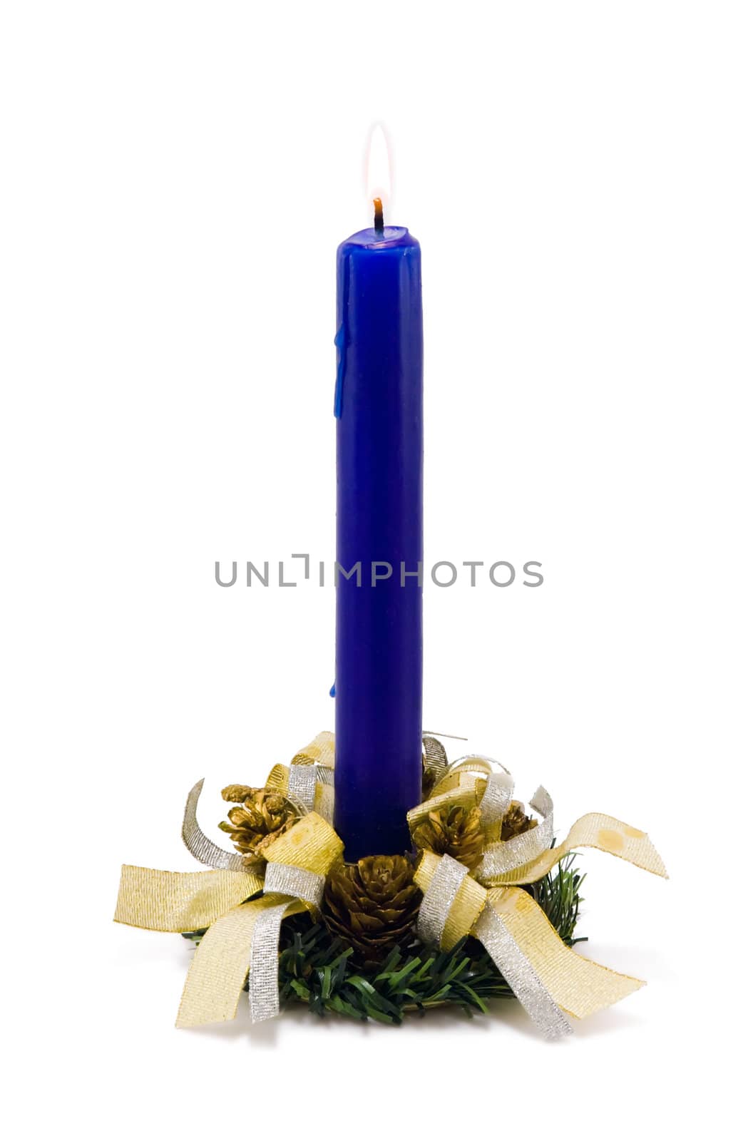 A blue candle decorated with candlestick and ribbons