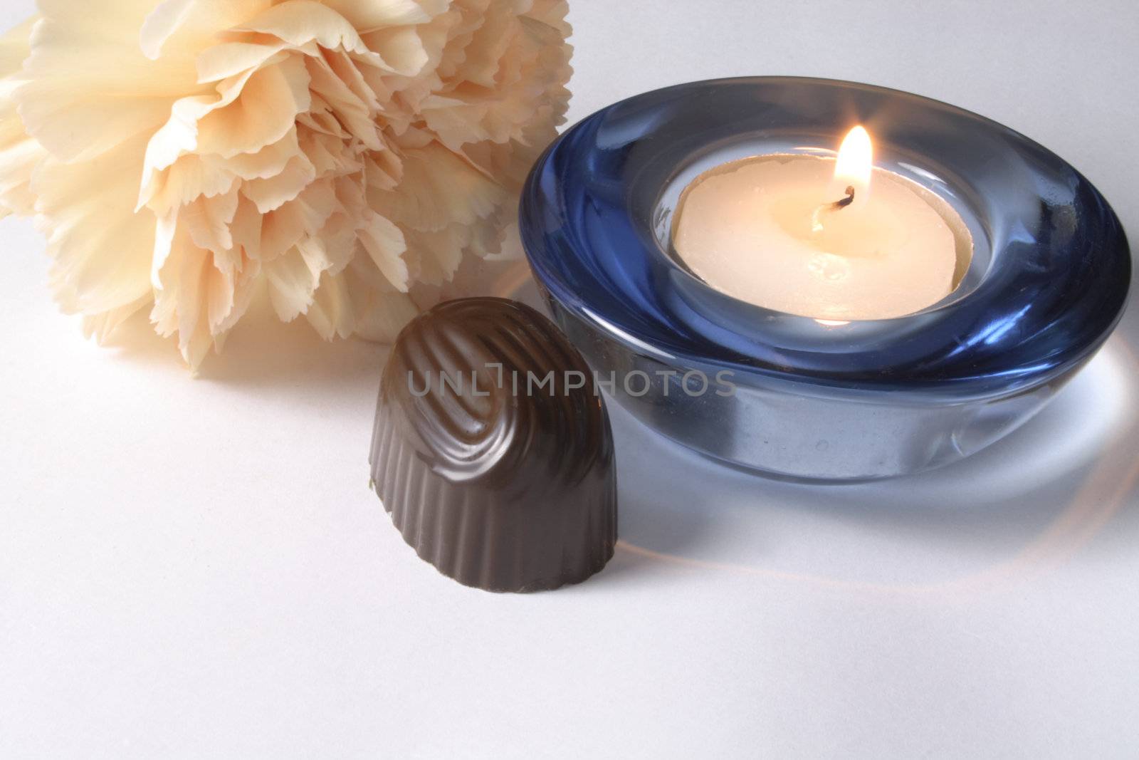 chocolate and carnation with a candle by leafy