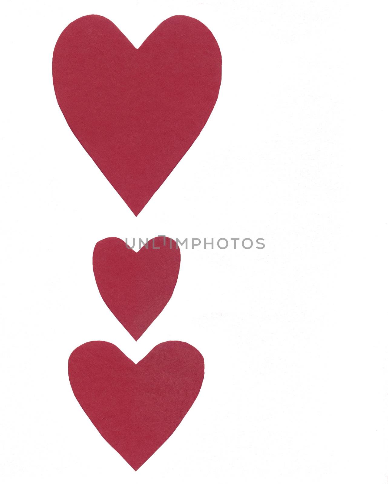three red paper hearts isolated over a white background