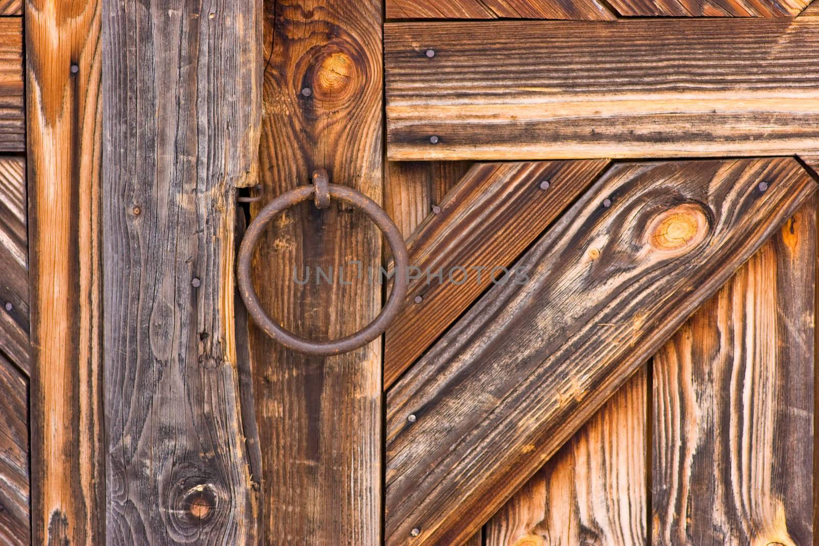 Rustic wooden barn door with metal handle