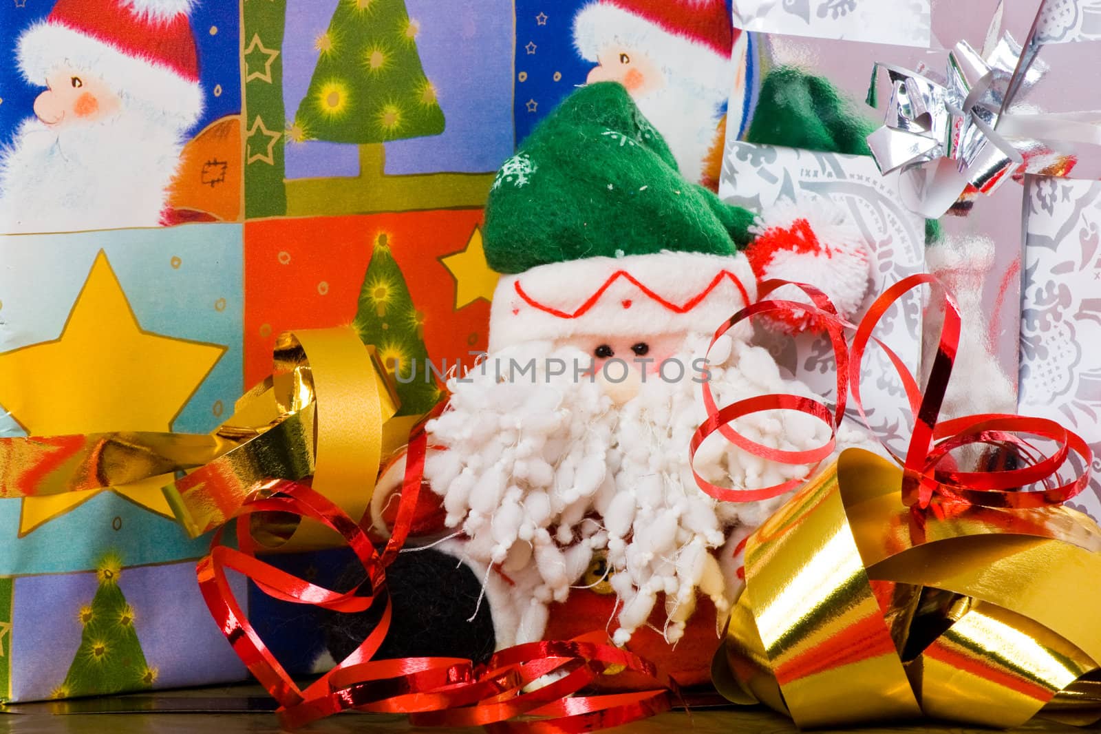 Santa puppet and decorated gift boxes with ribbons
