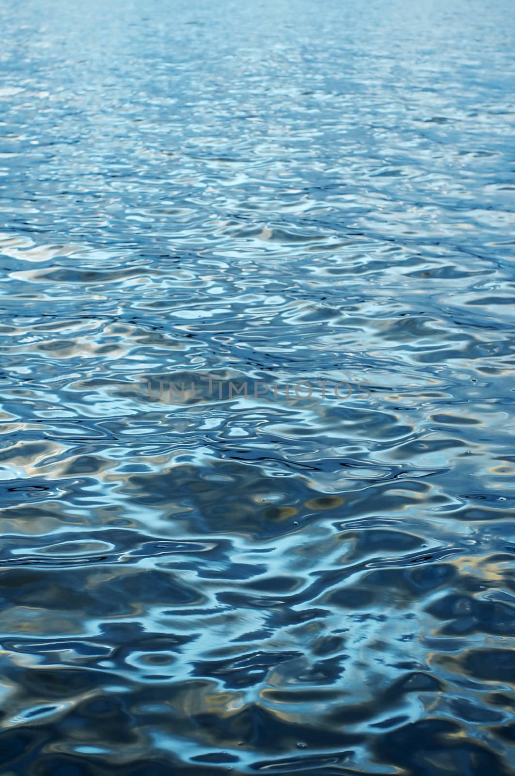 Blue water surface with light reflection