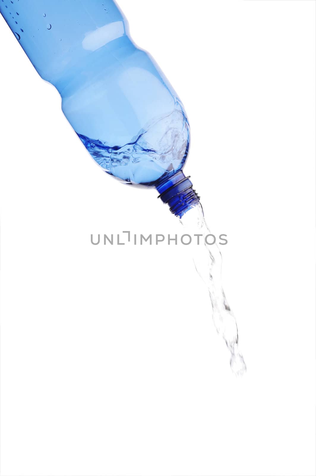 Pouring water from blue plastic water bottle