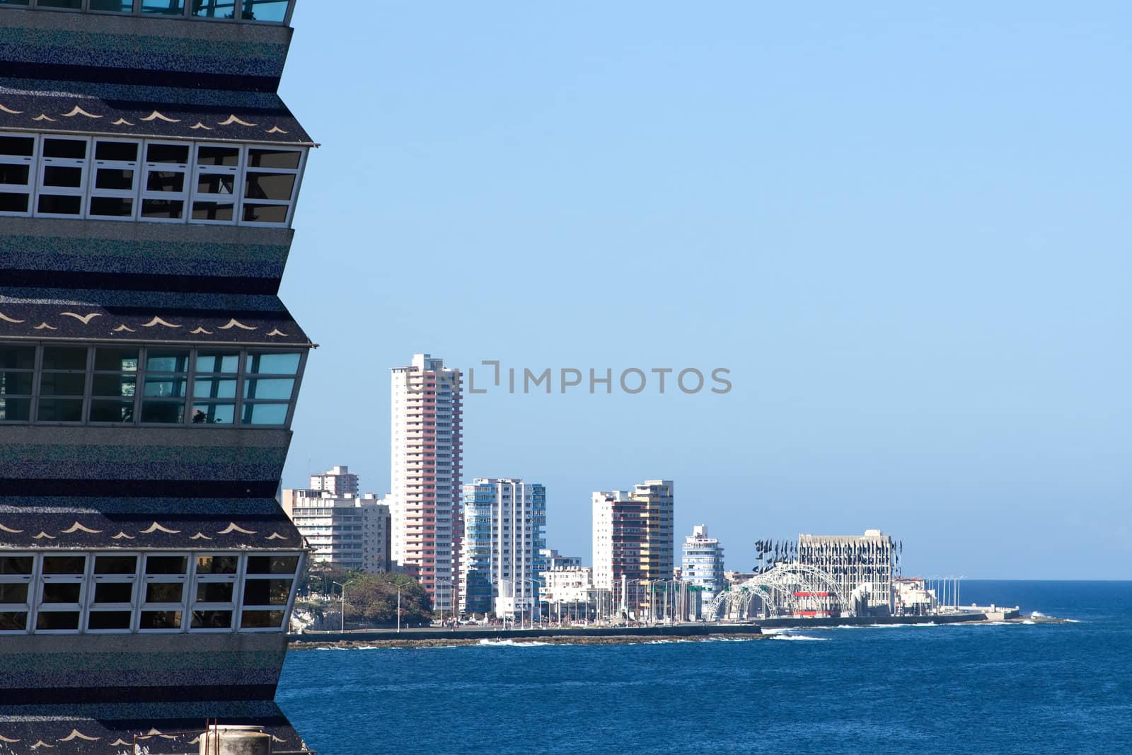 Coastline with skyscrapers and close-up view of a building`s corner. Havana, Cuba.