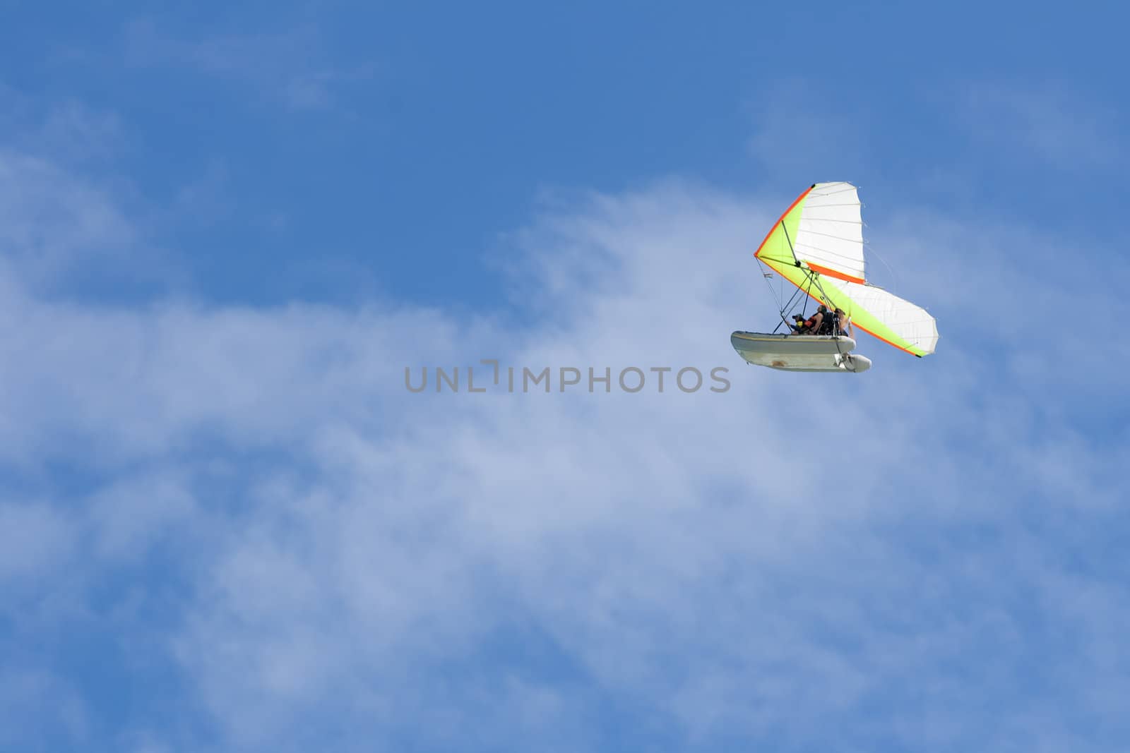 Hang-glider in a blue sky with two men onboard. Cayo Coco, Cuba.