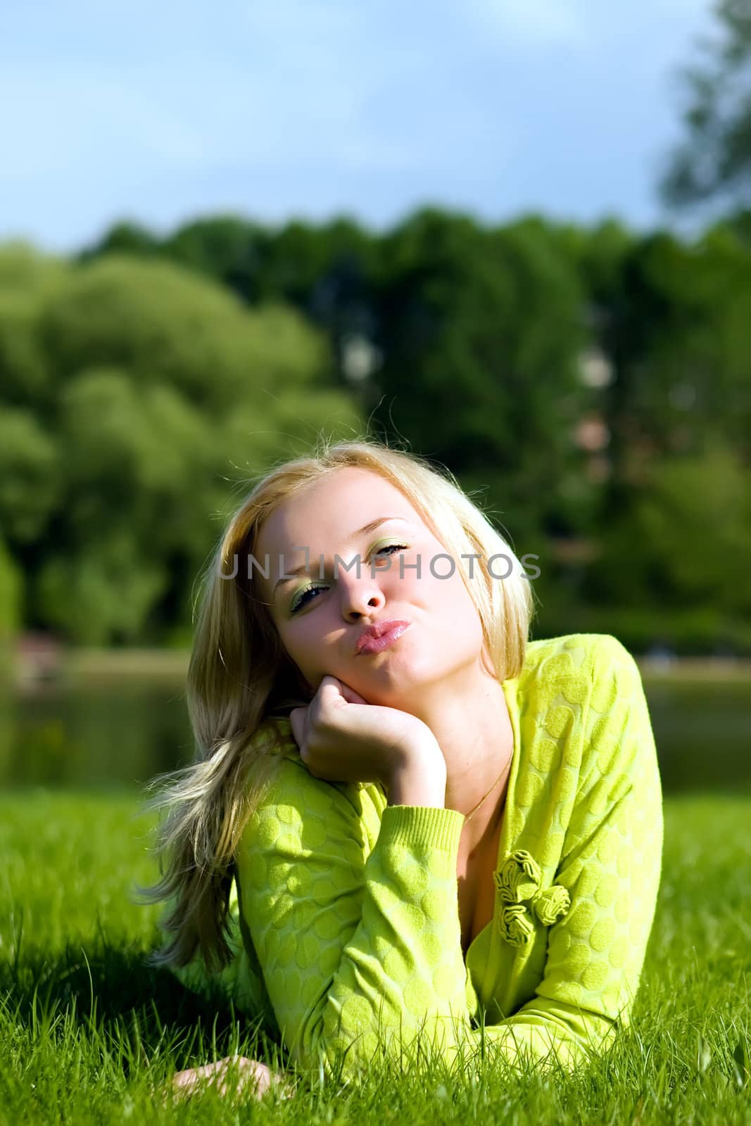 The girl lays on a grass a meadow