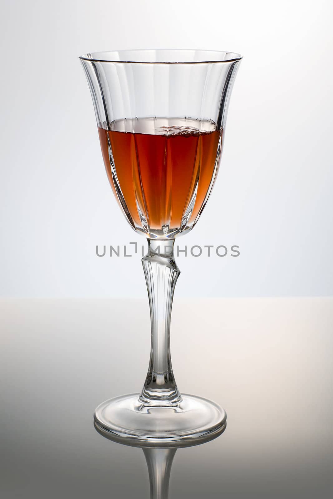 classic red wine glass over a light background