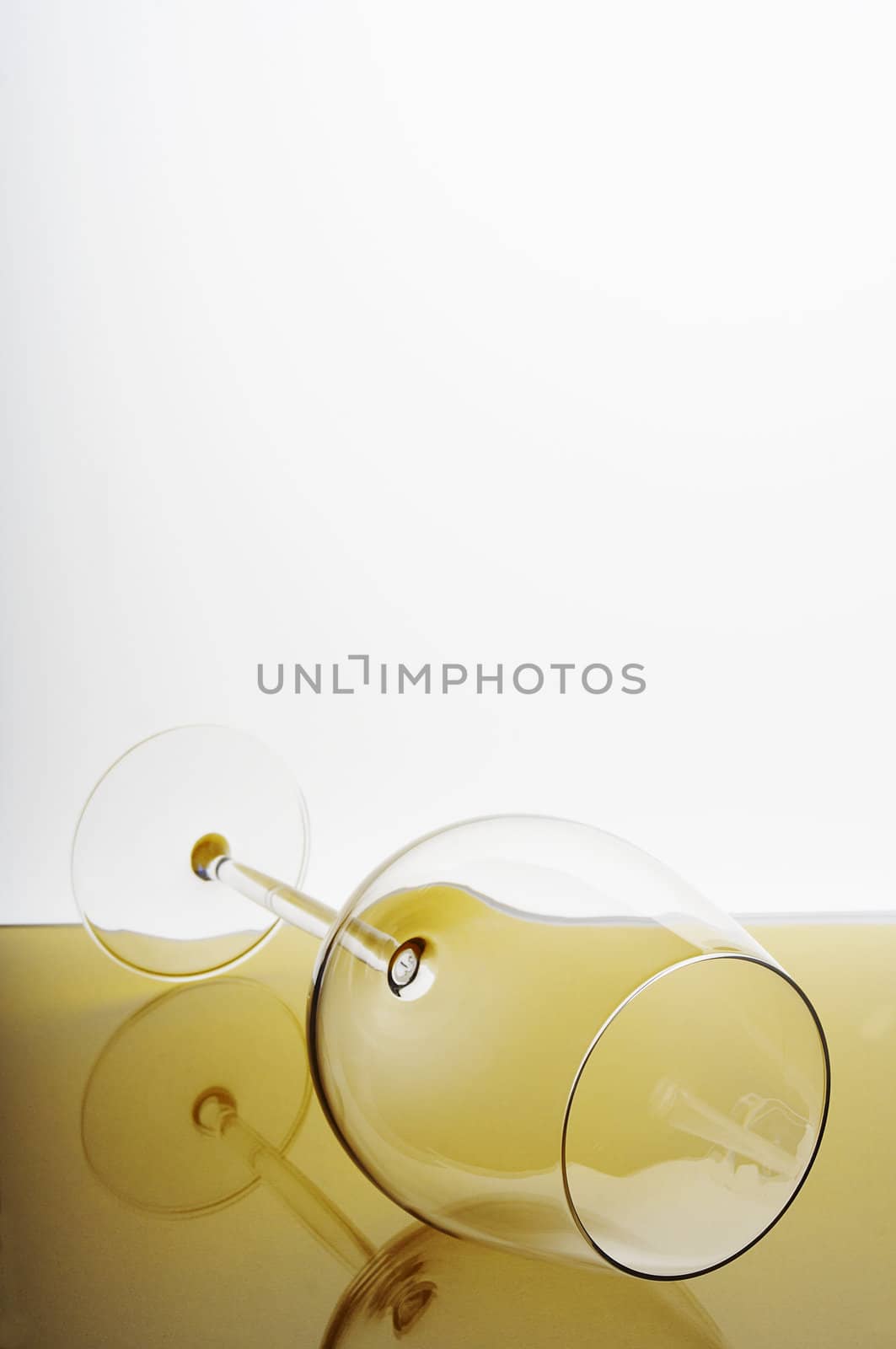 Fallen wine glass with reflection